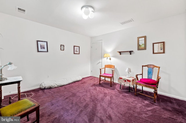 living area with carpet flooring and baseboards