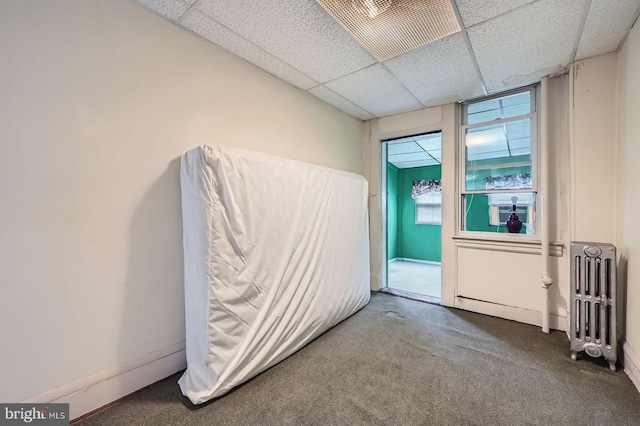 23 N Morley St, Baltimore, MD 21229 - carpeted empty room featuring radiator heating unit and a paneled ceiling