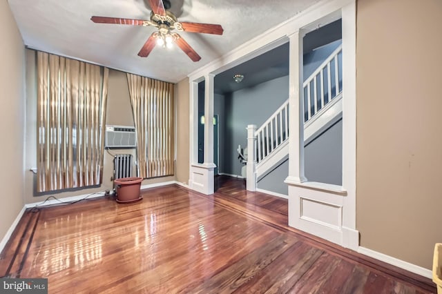 23 N Morley St, Baltimore, MD 21229 - spare room with wood finished floors, a ceiling fan, radiator heating unit, baseboards, and cooling unit
