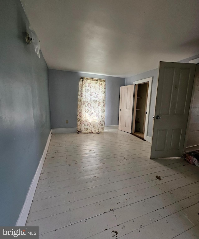 49 Front St, Wyoming, DE 19934 - spare room with hardwood / wood-style flooring and baseboards