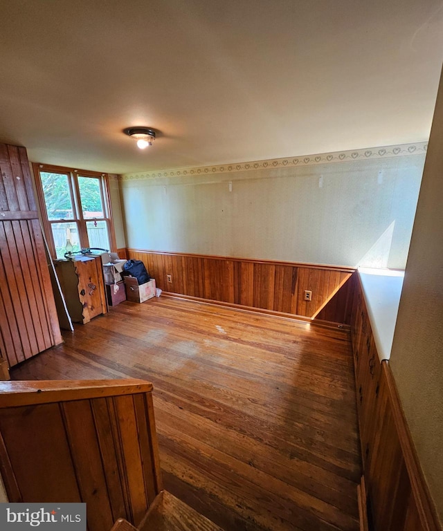 49 Front St, Wyoming, DE 19934 - spare room featuring hardwood / wood-style flooring and wood walls