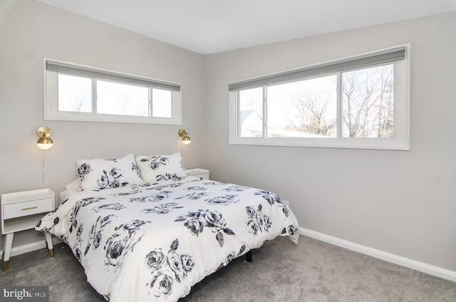 carpeted bedroom with baseboards