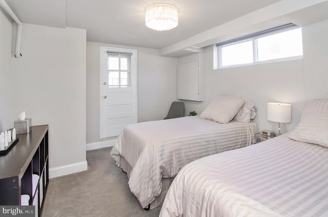 bedroom featuring carpet and baseboards