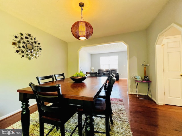 10400 Markby Ct, White Plains, MD 20695 - dining room with wood finished floors, arched walkways, and baseboards