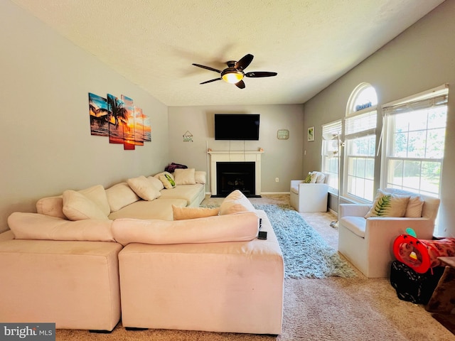 10400 Markby Ct, White Plains, MD 20695 - carpeted living room featuring a ceiling fan, a fireplace with flush hearth, and a textured ceiling