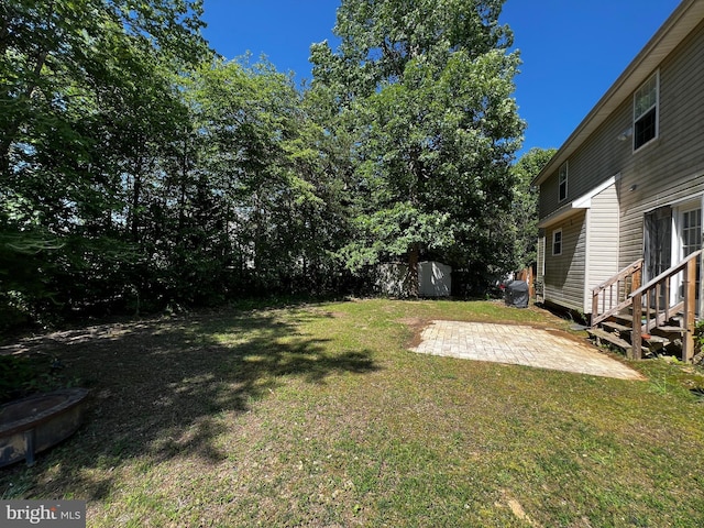 10400 Markby Ct, White Plains, MD 20695 - view of grassy yard featuring a patio area and entry steps
