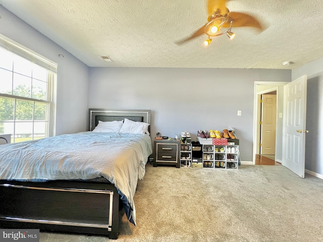 10400 Markby Ct, White Plains, MD 20695 - bedroom with carpet, a textured ceiling, and ceiling fan