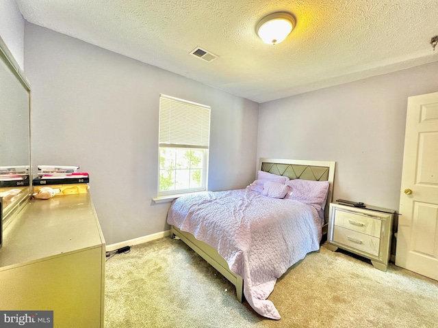 10400 Markby Ct, White Plains, MD 20695 - bedroom with light carpet, a textured ceiling, and baseboards