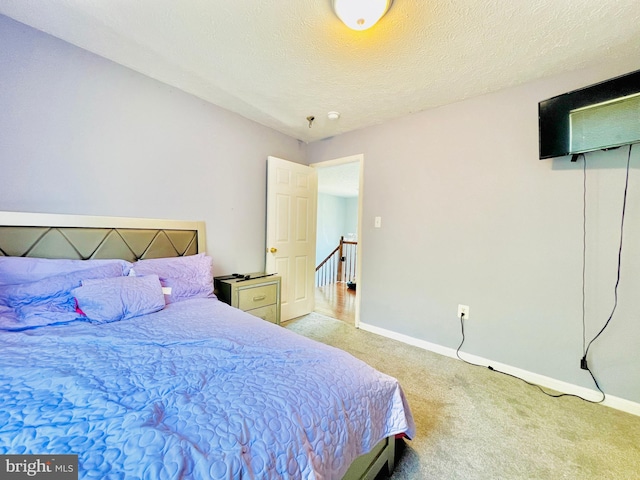 10400 Markby Ct, White Plains, MD 20695 - carpeted bedroom with baseboards and a textured ceiling