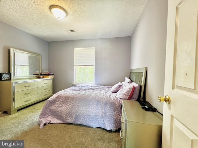 10400 Markby Ct, White Plains, MD 20695 - bedroom with light colored carpet and a textured ceiling