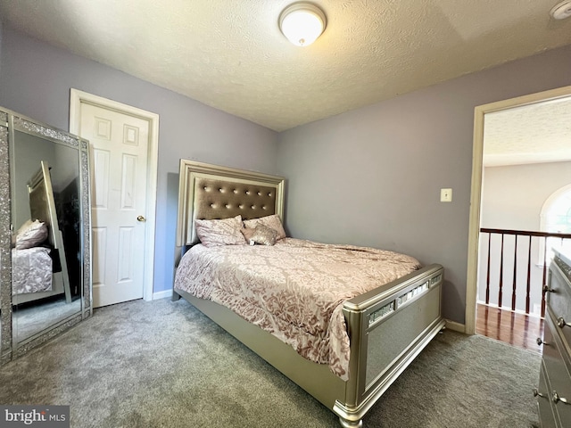10400 Markby Ct, White Plains, MD 20695 - bedroom featuring carpet floors, a textured ceiling, and baseboards