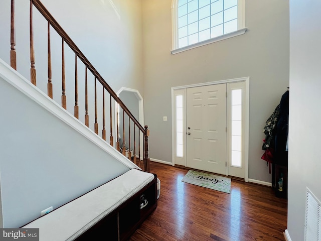 10400 Markby Ct, White Plains, MD 20695 - entrance foyer with a towering ceiling, dark wood-style flooring, stairway, and baseboards