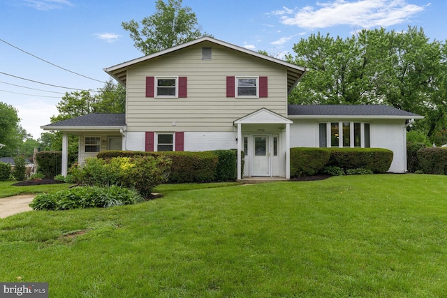 3702 Forest Grove Dr, Annandale, VA 22003 - view of front of home featuring brick siding, a front yard, and a shingled roof