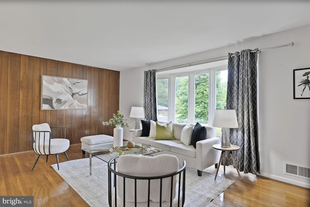 3702 Forest Grove Dr, Annandale, VA 22003 - living area featuring wooden walls, wood finished floors, and baseboards