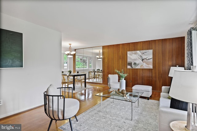 3702 Forest Grove Dr, Annandale, VA 22003 - living room with a chandelier, wood finished floors, and wood walls