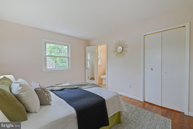 3702 Forest Grove Dr, Annandale, VA 22003 - bedroom with wood finished floors, baseboards, ensuite bathroom, and a closet