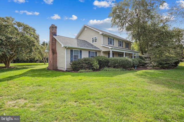 24749 Swan Rd, Saint Michaels, MD 21663 - view of front of home featuring a chimney and a front lawn