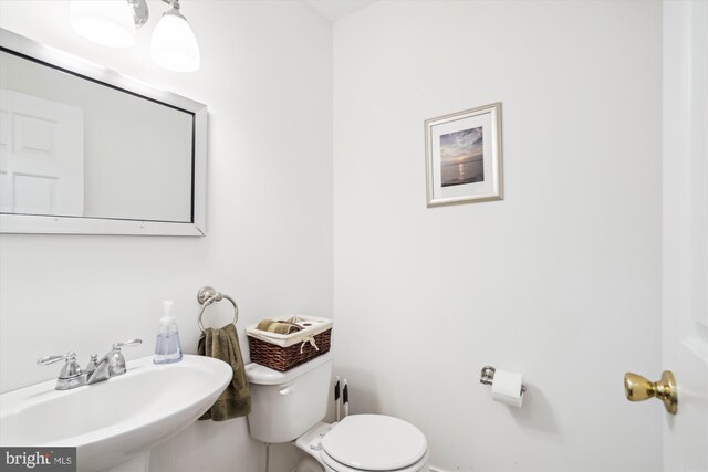 24749 Swan Rd, Saint Michaels, MD 21663 - half bath featuring a sink and toilet
