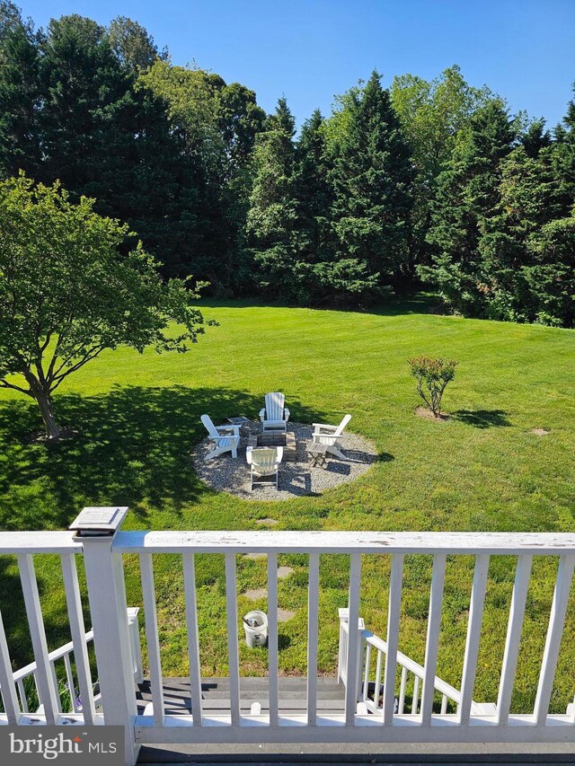 24749 Swan Rd, Saint Michaels, MD 21663 - view of grassy yard featuring an outdoor fire pit