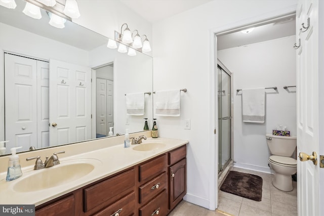 24749 Swan Rd, Saint Michaels, MD 21663 - bathroom with tile patterned flooring, toilet, double vanity, a shower stall, and baseboards