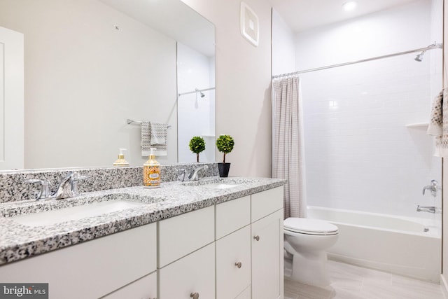 bathroom with toilet, double vanity, and shower / tub combo