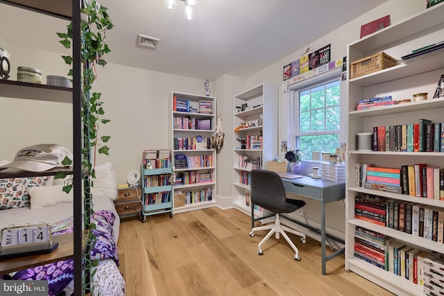 home office with wood finished floors