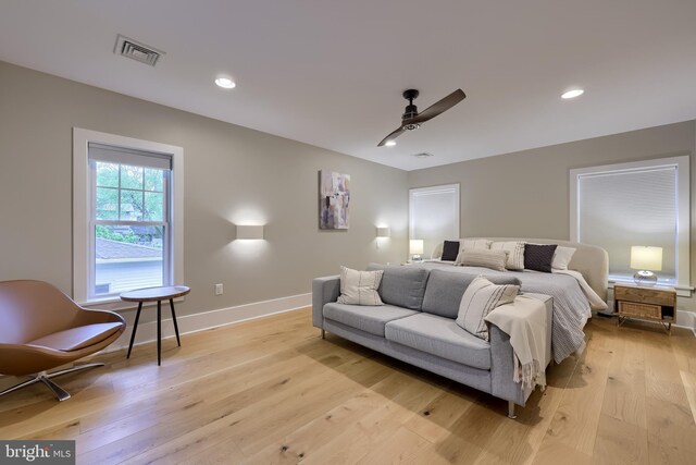 bedroom with light wood finished floors, baseboards, a ceiling fan, and recessed lighting
