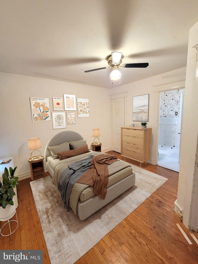 bedroom with wood finished floors and ceiling fan