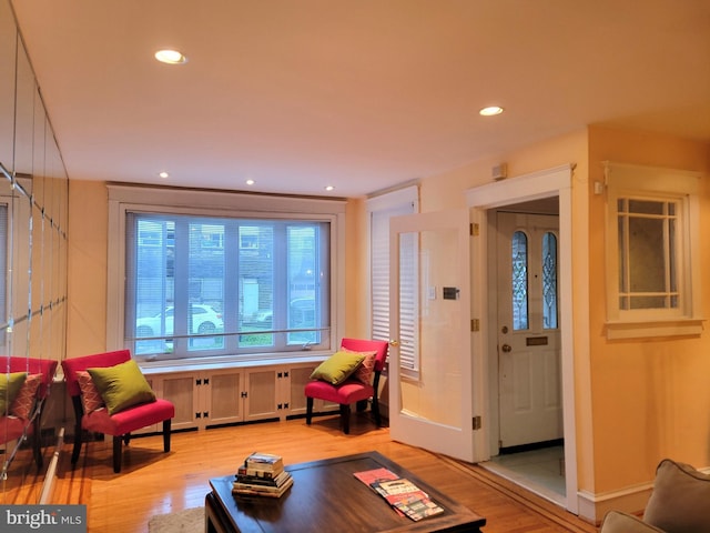 living room with light wood-style floors and recessed lighting