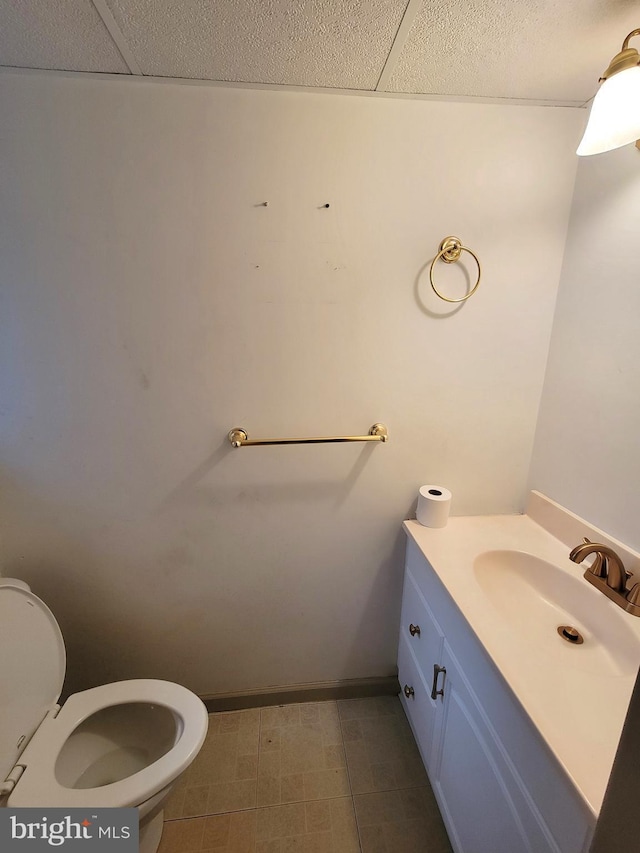 half bathroom featuring toilet and vanity