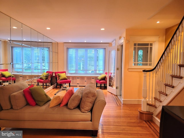 living room with wood finished floors, stairs, recessed lighting, and baseboards