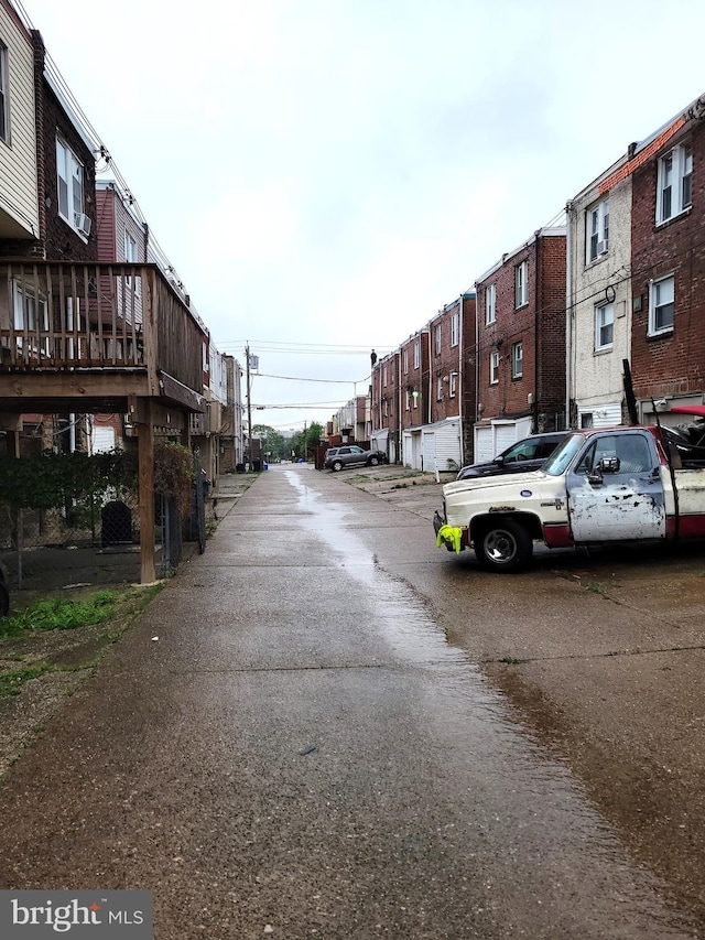 view of asphalt road featuring a residential view