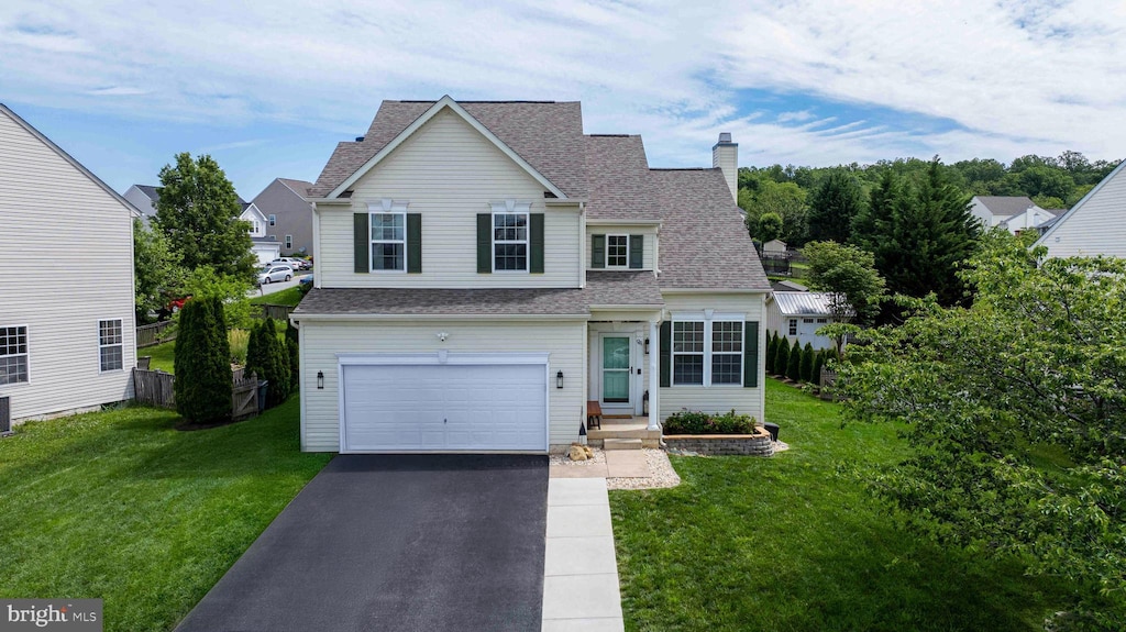 94 Caperton Dr, Charles Town, WV 25414 - traditional-style house featuring a chimney, driveway, a garage, and a front lawn