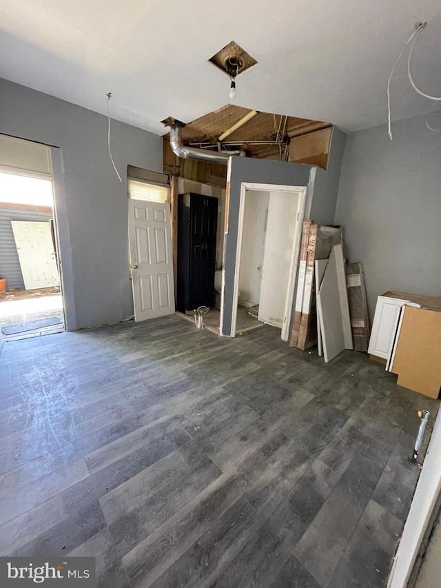 unfurnished living room with dark wood-style floors