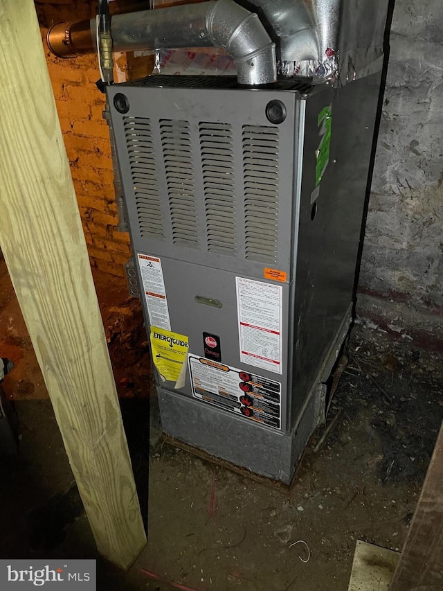 utility room featuring heating unit