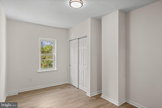 1294 Chase St, Camden, NJ 08104 - unfurnished bedroom featuring wood finished floors, a closet, and baseboards
