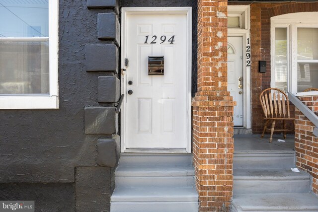 1294 Chase St, Camden, NJ 08104 - doorway to property with brick siding