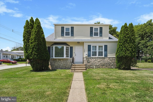 1558 Lukens Ave, Abington, PA 19001 - view of front facade with entry steps, stone siding, a front lawn, and a shingled roof