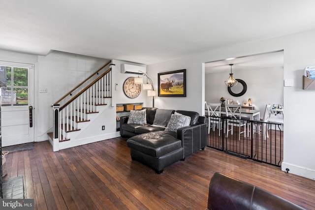 1607 Weavertown Rd, Douglassville, PA 19518 - living room with an AC wall unit, stairway, wood-type flooring, and baseboards
