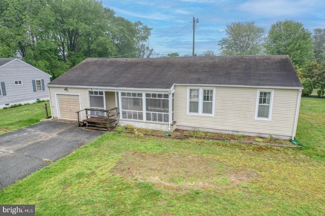 85 Woodland Ave, Ocean View, DE 19970 - view of front of home with driveway, a garage, a front yard, and roof with shingles