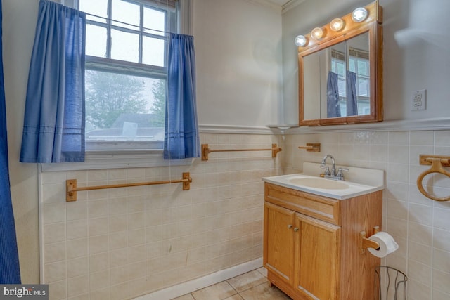 85 Woodland Ave, Ocean View, DE 19970 - bathroom with vanity, tile patterned floors, tile walls, a wainscoted wall, and ornamental molding
