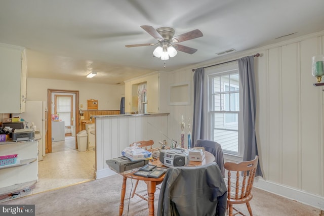 85 Woodland Ave, Ocean View, DE 19970 - dining area with a ceiling fan, a decorative wall, and light colored carpet