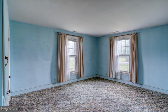85 Woodland Ave, Ocean View, DE 19970 - empty room with plenty of natural light and baseboards