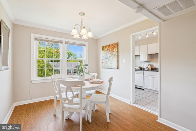 6624 Boulevard Vw Unit C1, Alexandria, VA 22307 - dining space with a chandelier, light wood-style flooring, crown molding, and baseboards