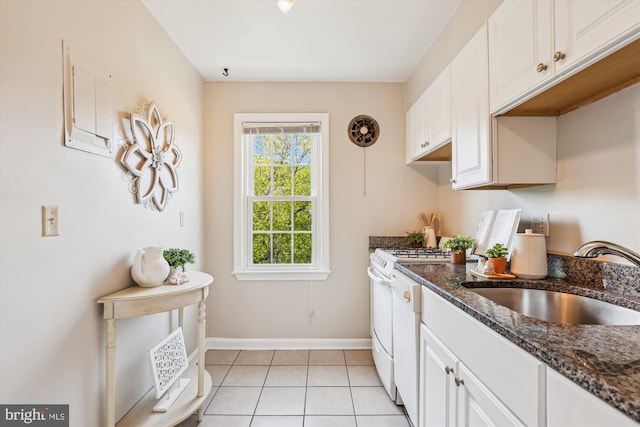 6624 Boulevard Vw Unit C1, Alexandria, VA 22307 - kitchen featuring a sink, baseboards, white cabinetry, light tile patterned floors, and dark stone countertops