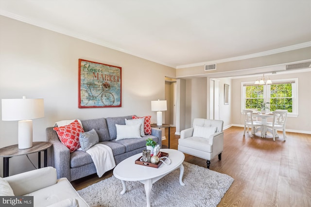 6624 Boulevard Vw Unit C1, Alexandria, VA 22307 - living room featuring wood finished floors, ornamental molding, baseboards, and a chandelier