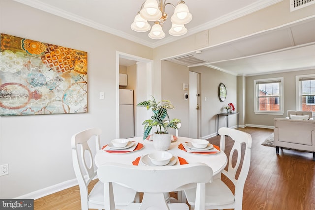 6624 Boulevard Vw Unit C1, Alexandria, VA 22307 - dining space with a chandelier, light wood finished floors, baseboards, and ornamental molding