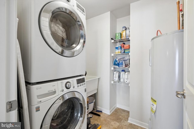 232 Urban Ave Unit 232, Gaithersburg, MD 20878 - washroom with electric water heater, stacked washer and clothes dryer, and baseboards