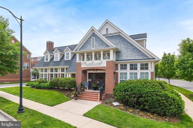 232 Urban Ave Unit 232, Gaithersburg, MD 20878 - view of front of house with a front yard, brick siding, and a chimney