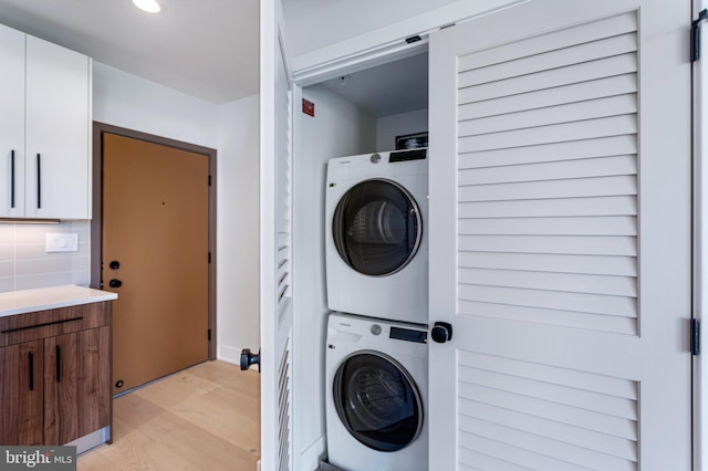 845 19th St NE Unit Ph-12, Washington, DC 20002 - laundry area featuring stacked washer / dryer and recessed lighting